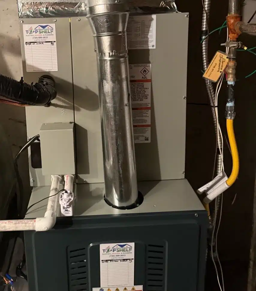 Trane furnace and air handler installed in a Denver, CO basement utility room by Top Shelf Heating & Plumbing