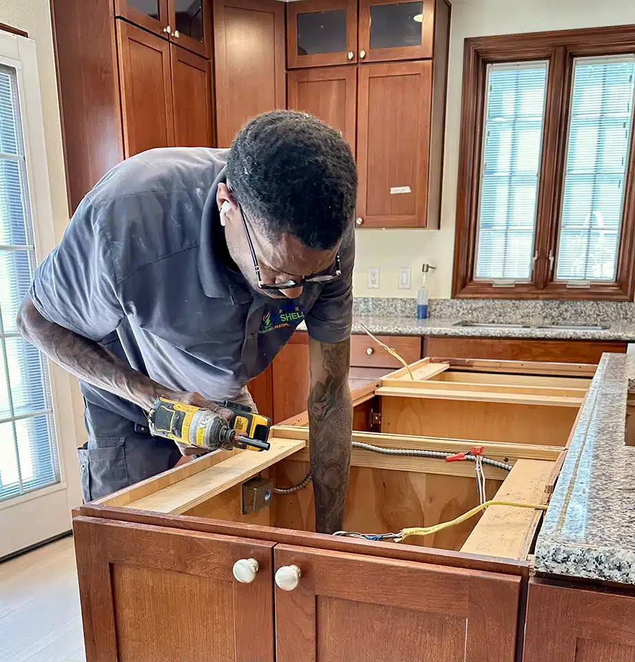 Technician installing outlets in Denver, CO.