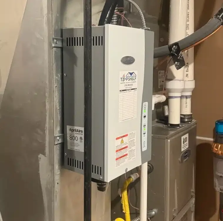 AprilAire 800 whole-home steam humidifier mounted to ductwork by Top Shelf Electric Heating & Plumbing in Denver, CO