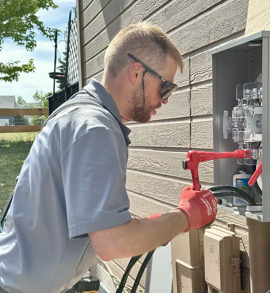 Top Shelf technician servicing electrical panel.