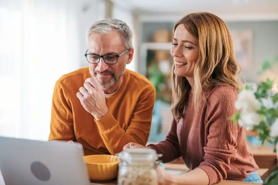 couple looking at financing options on computer